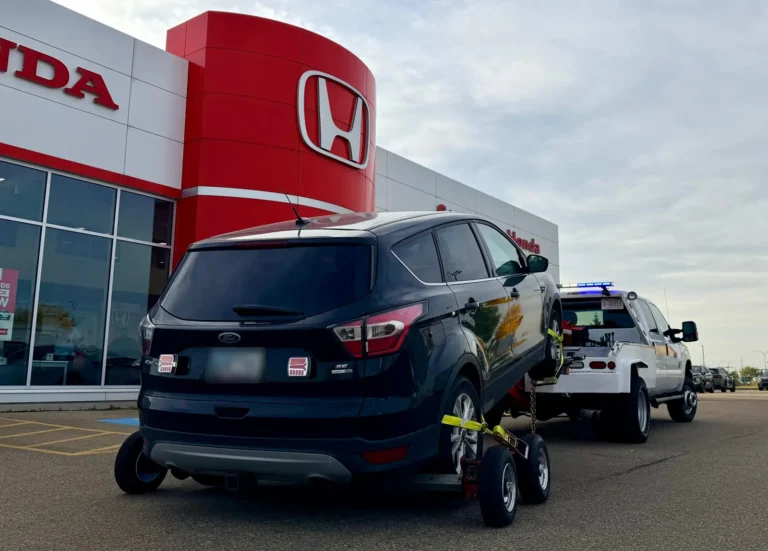 AWD SUV towed on dollies to a dealership in St. Albert
