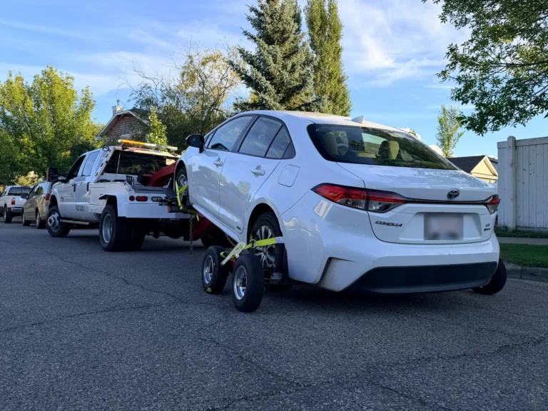 Sedan towed with a wheel lift and dollies in Edmonton
